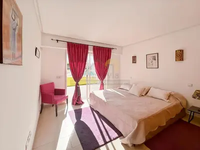 a bedroom with a bed and a large window at Exceptional Villa Private Pool - Ourika Road in Marrakech