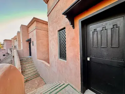 a black door on the side of a building at Elegant Cocoon 2 Bedrooms, Pool & Rooftop in Marrakech