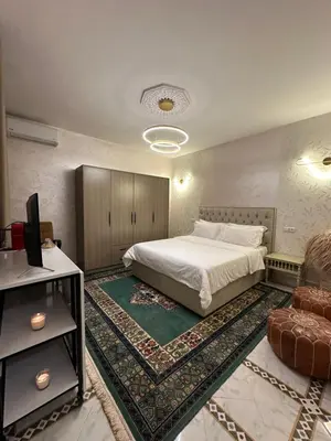 a bedroom with a bed and a tv and a couch at Marrakech Airport in Marrakech