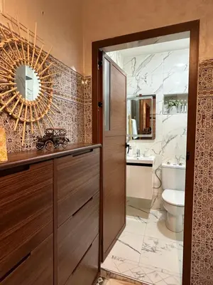 a bathroom with a sink and a toilet and a mirror at Marrakech Airport in Marrakech