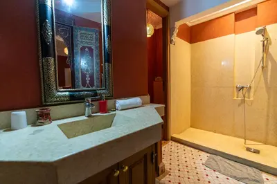 a bathroom with a sink and a shower at Palais Nejma - Locanda Boutique Collection in Marrakech