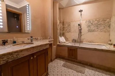 a bathroom with two sinks and a bath tub at Palais Nejma - Locanda Boutique Collection in Marrakech