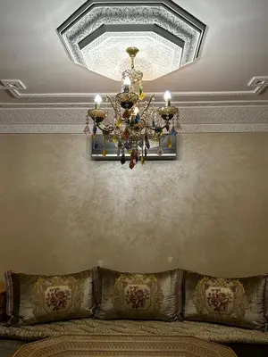 a chandelier hanging from a ceiling in a room at Riad Dar Kenza in Marrakech