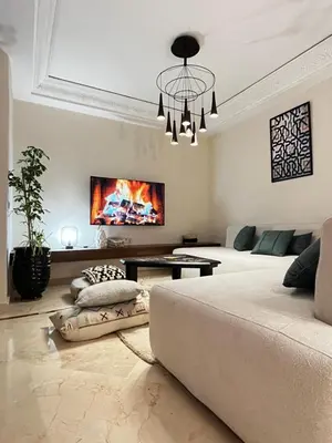 a living room with a couch and a fireplace at Quiet & Central 1BR Apart with Pool in Gueliz in Marrakech