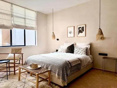 a bedroom with a bed and a table and a chair at Dar 43 with Private Pool Breakfast Included in Marrakech