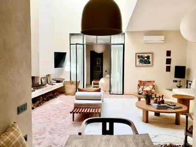 a living room with a couch and a table at Dar 43 with Private Pool Breakfast Included in Marrakech