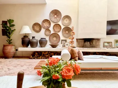 a living room with plates on the wall at Dar 43 with Private Pool Breakfast Included in Marrakech