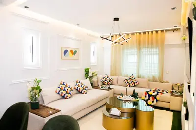 a living room with a couch and a table at Grand appartement Guéliz in Marrakech