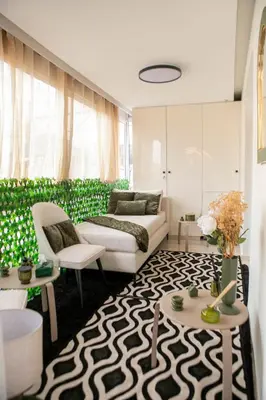 a living room with a couch and a table at Grand appartement Guéliz in Marrakech