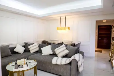 a living room with a couch and a table at Luxurious apartment in Marrakech