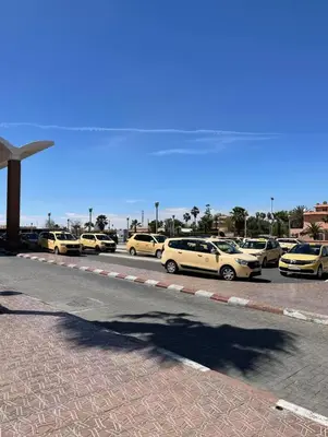 a row of parked cars in a parking lot at Premium studio - Hivernage Marrakech in Marrakech