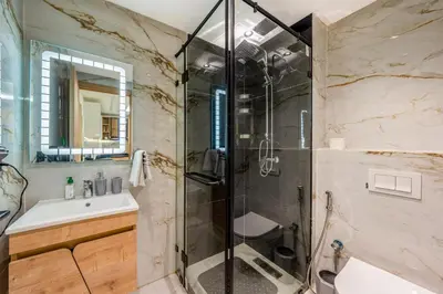 a bathroom with a shower and a sink at Stylish Flat, Aube hivernage Fibre-Pool & Parking in Oulad Akkou
