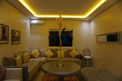 a living room with a couch and a table at Comfort Appartment Centre Marrakech in Marrakech