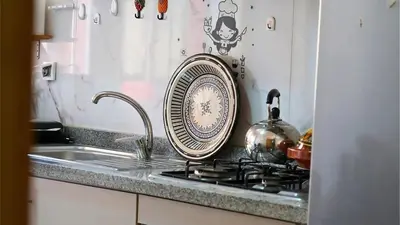 a plate sitting on a kitchen counter next to a sink at Marrakech Chic apartment in Marrakech