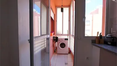 a washing machine in a laundry room with a window at Marrakech Chic apartment in Marrakech