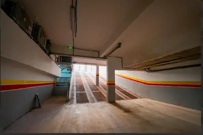 an empty room with colorful stripes on the walls at Magnifique Appartement Hivernage in Marrakech