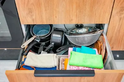 a drawer filled with utensils and a pot at Magnifique Appartement Hivernage in Marrakech
