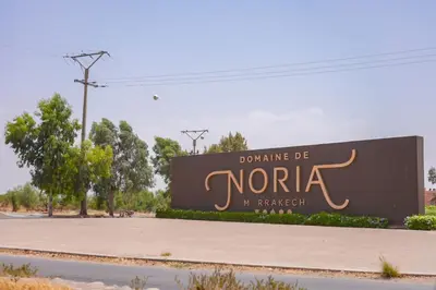 a sign for the entrance to a northazar sign at Appartement Domaine de Nouria in Marrakech