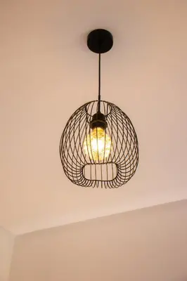 aendant light hanging from the ceiling of a room at Appartement avec GOLF PISCINE Prestigia Jade in Marrakech