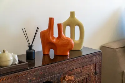 a table with two vases sitting on top of it at Urban Escape in Gueliz with Balcony and Wifi in Marrakech