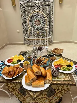 a table filled with plates of food on a table at Le style a marrakech in Marrakech