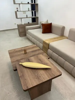 a surfboard on a wooden table in a living room at Le style a marrakech in Marrakech