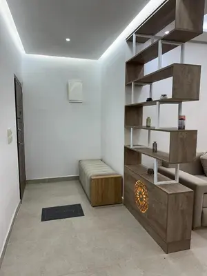 a living room with a couch and a shelf at Le style a marrakech in Marrakech