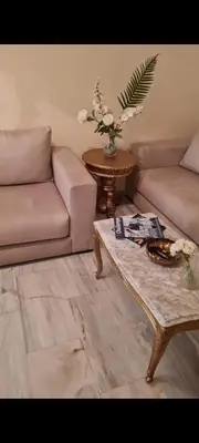 a living room with a couch and a coffee table at Nilia in Marrakech