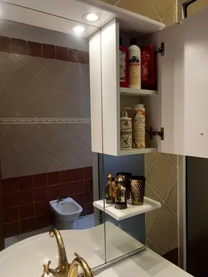 a bathroom with a sink and a toilet at Luxurious Traditional & Modern Apartment Guéliz in Marrakech