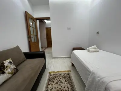 a living room with a couch and a bed at Luxurious Traditional & Modern Apartment Guéliz in Marrakech