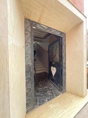 a mirror with a heart on it in a room at Lovely Family aparts LAGUASSEM in El Gouassem