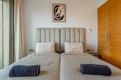 a bedroom with two beds with pillows at Comfy Flat 2 BedRooms-Argan Golf Atlas View in Marrakech