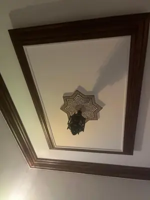 a coffered ceiling with a wooden frame on a ceiling at Riad traditionnel Kham's centre Marrakech in Marrakech