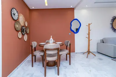 a dining room with a table and chairs at Modern Chic Apartment in Gueliz in Marrakech