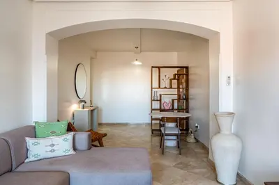 a living room with a couch and a table at Luxury Flat Private Rooftop & Heated Pool Guéliz in Marrakech