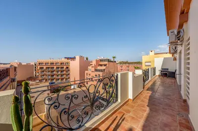 a balcony with a view of the city at Luxury Flat Private Rooftop & Heated Pool Guéliz in Marrakech