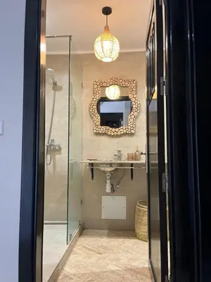 a bathroom with a sink and a mirror on the wall at Résidence Atlas Golf Marrakech in Marrakech