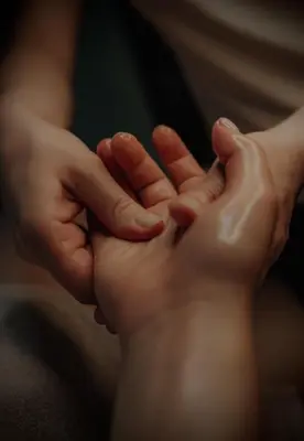 a person holding the hands of a child at Riad Kalemat & Spa in Marrakech