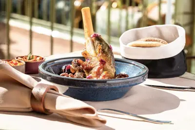 a blue bowl of food on a table at Riad Kalemat & Spa in Marrakech