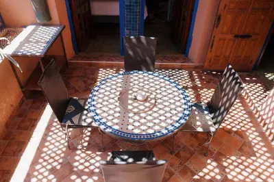 an overhead view of a table and chairs on a patio at Cozy Quiet Traditional Apartment in Dar Caïd Layadi