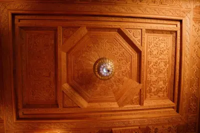 a wooden ceiling with a clock on it at Cozy Quiet Traditional Apartment in Dar Caïd Layadi