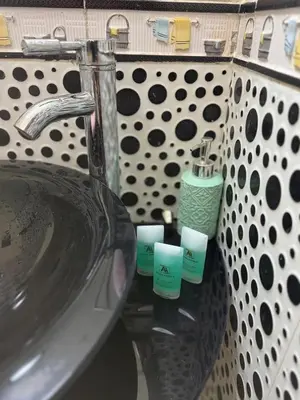 a bathroom sink with three candles on it at Comfortable stay - Marrakech style in Marrakech