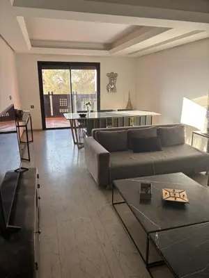 a living room with a couch and a table at Menara Garden Gueliz Marrakech in Oulad Akkou
