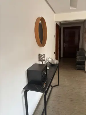 a black table with a microwave on a wall at Menara Garden Gueliz Marrakech in Oulad Akkou