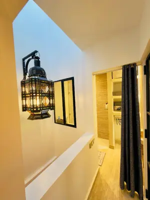a chandelier hanging from a wall in a hallway at RIAD El Ma in Marrakech