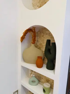 a shelf with vases and a pot on it at RIAD El Ma in Marrakech