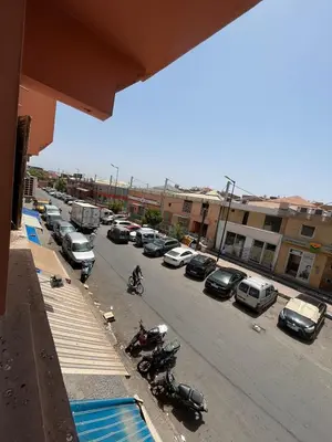 a view of a parking lot with cars and motorcycles at 3Br in heart of Marrakech 15min from downtown in Marrakech