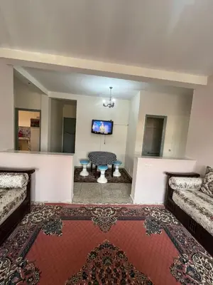 a living room with a couch and a table at 3Br in heart of Marrakech 15min from downtown in Marrakech
