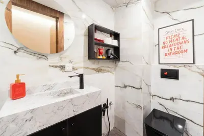 a bathroom with a sink and a mirror at Jacuzzi Private Terrace Design Central Apartment in Marrakech
