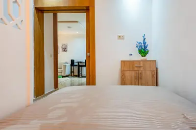 a bedroom with a bed and a dresser at Le Grand Chic in Marrakech